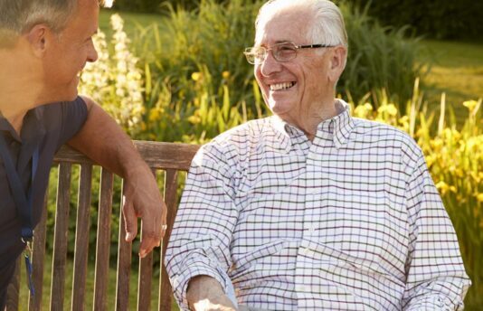 Man visiting with a senior
