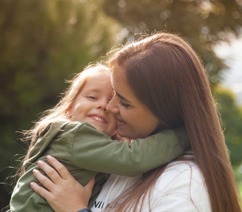 Mother holding daughter